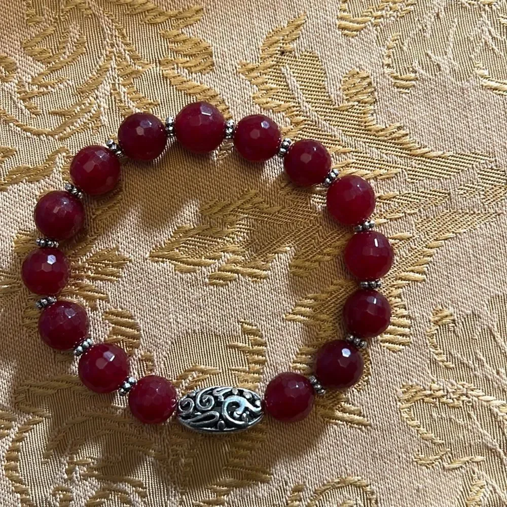 Handcrafted beaded bracelet with metal bead detail
